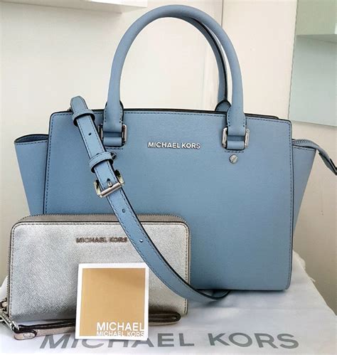 michael kors baby blue purse.